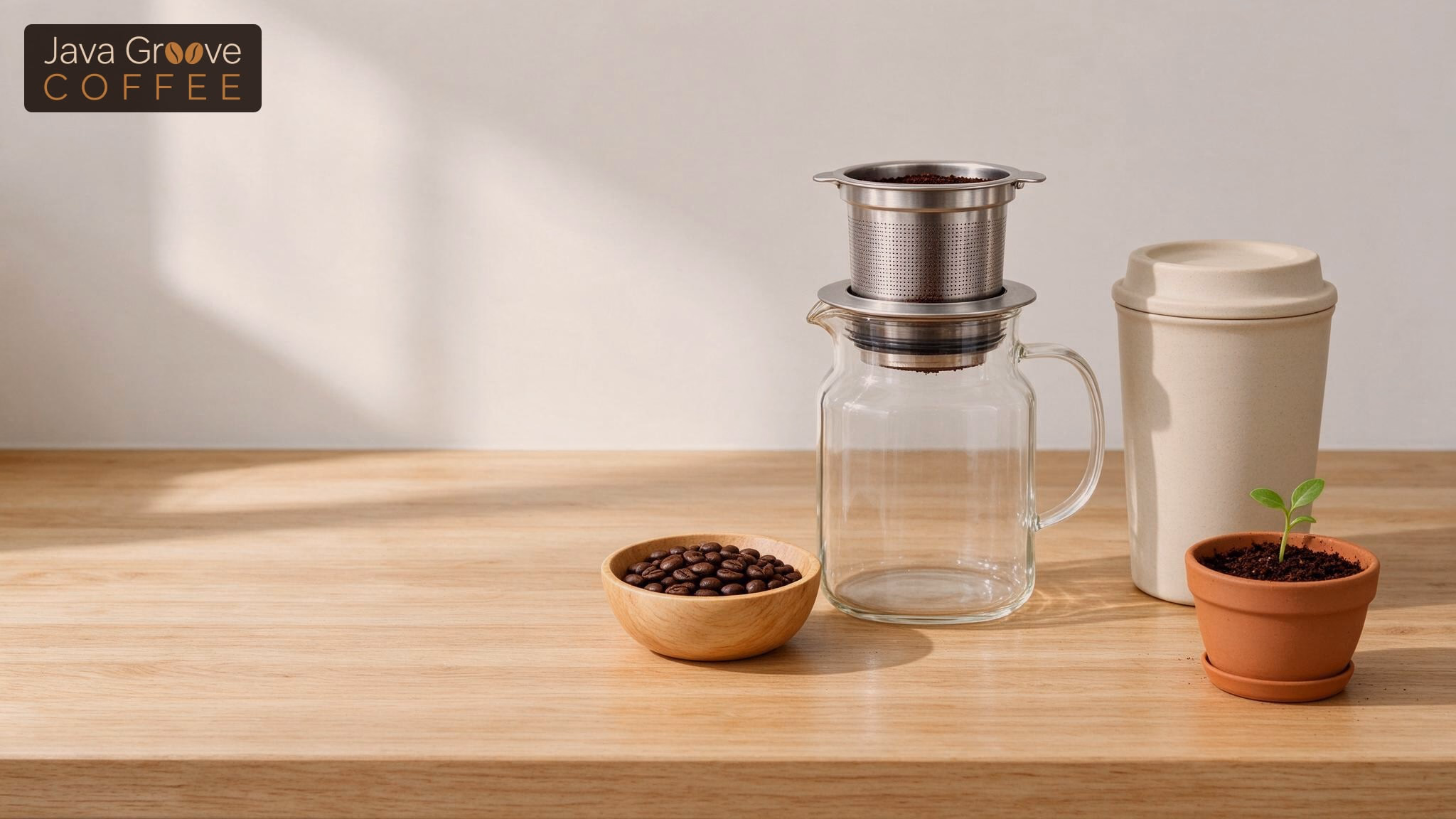 Eco-friendly coffee habits, a pour-over dripper, reusable cup, coffee beans and a seedling