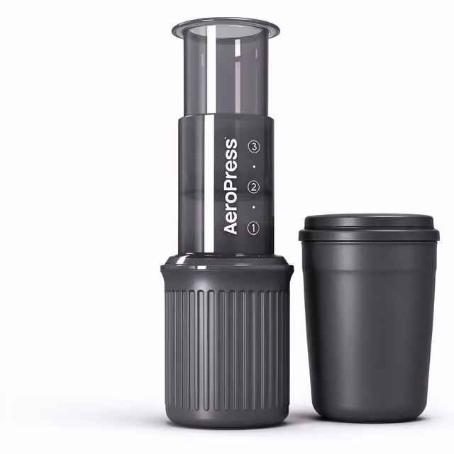 AeroPress Go travel coffee press next to its mug