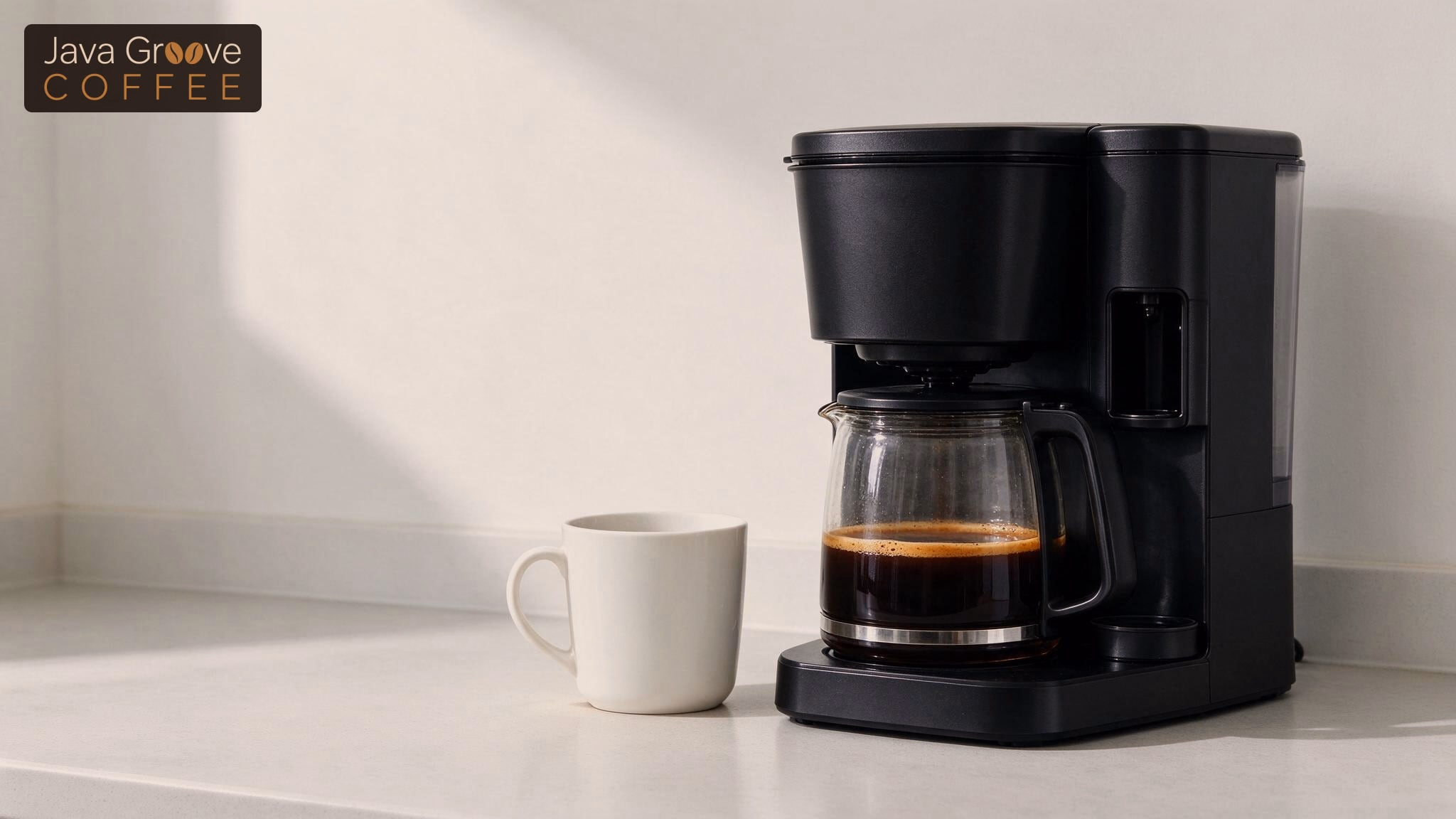Best coffee makers at Target: a black drip maker with a carafe and mug