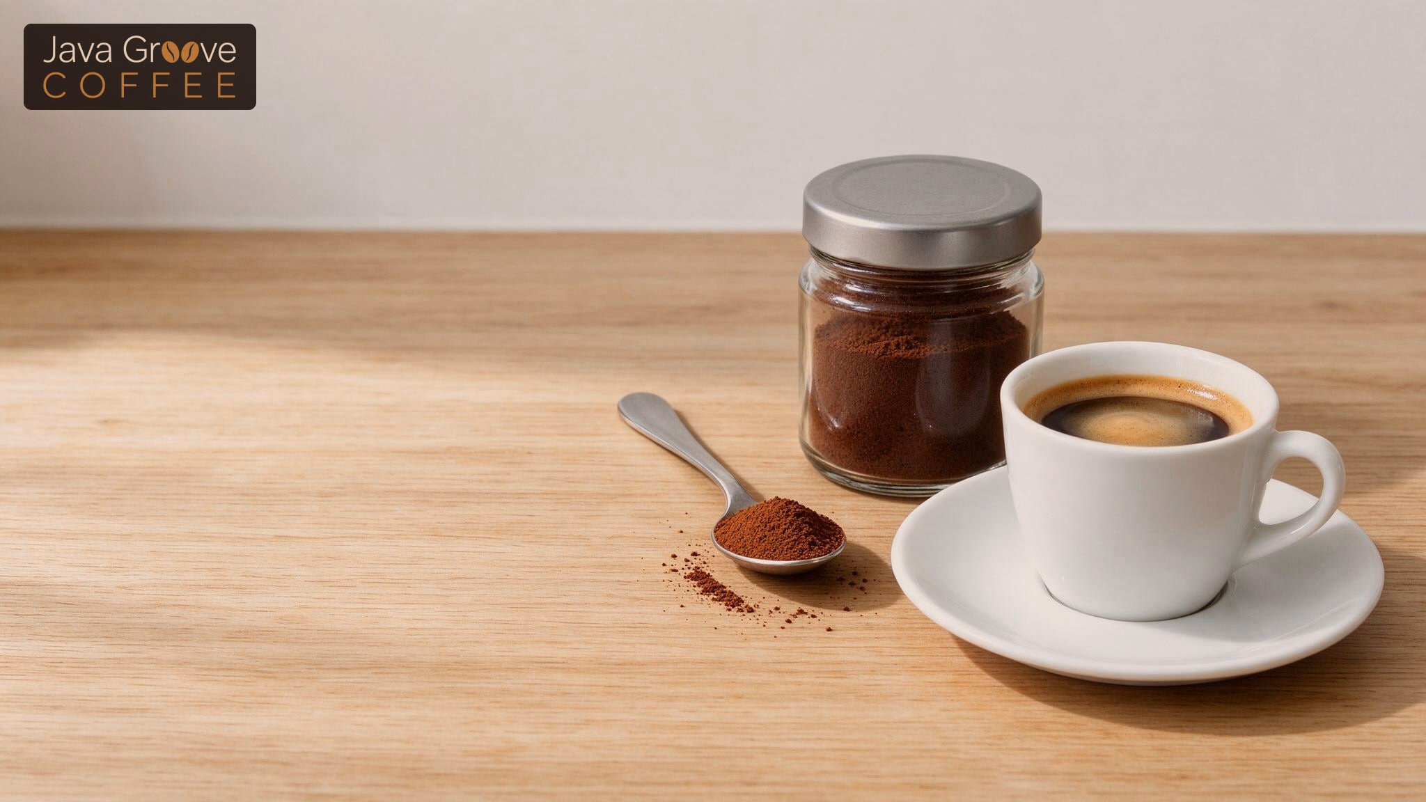 Best instant espresso powder: jar of espresso powder beside a cup of espresso