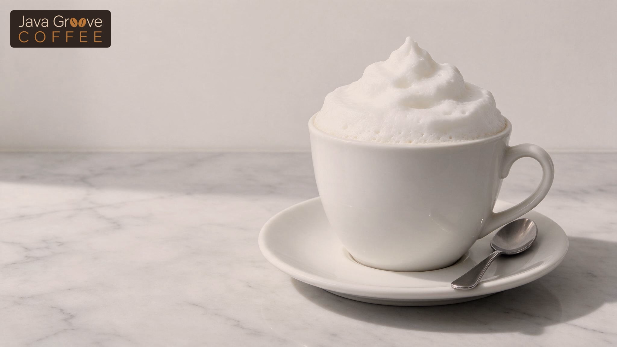 Bone dry cappuccino, a white cup filled with stiff milk foam