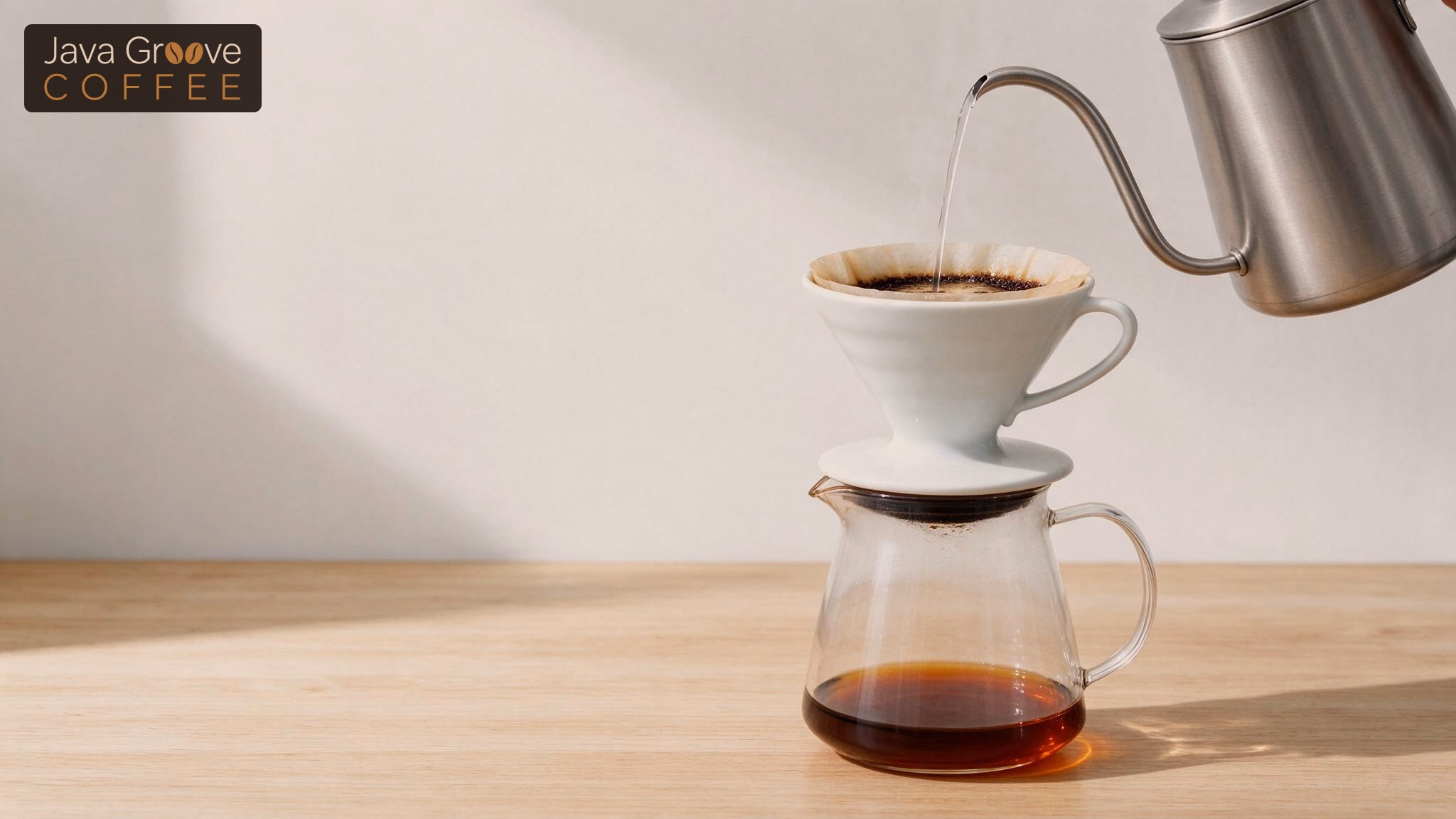 Coffee pour over techniques: gooseneck kettle pouring into a ceramic dripper