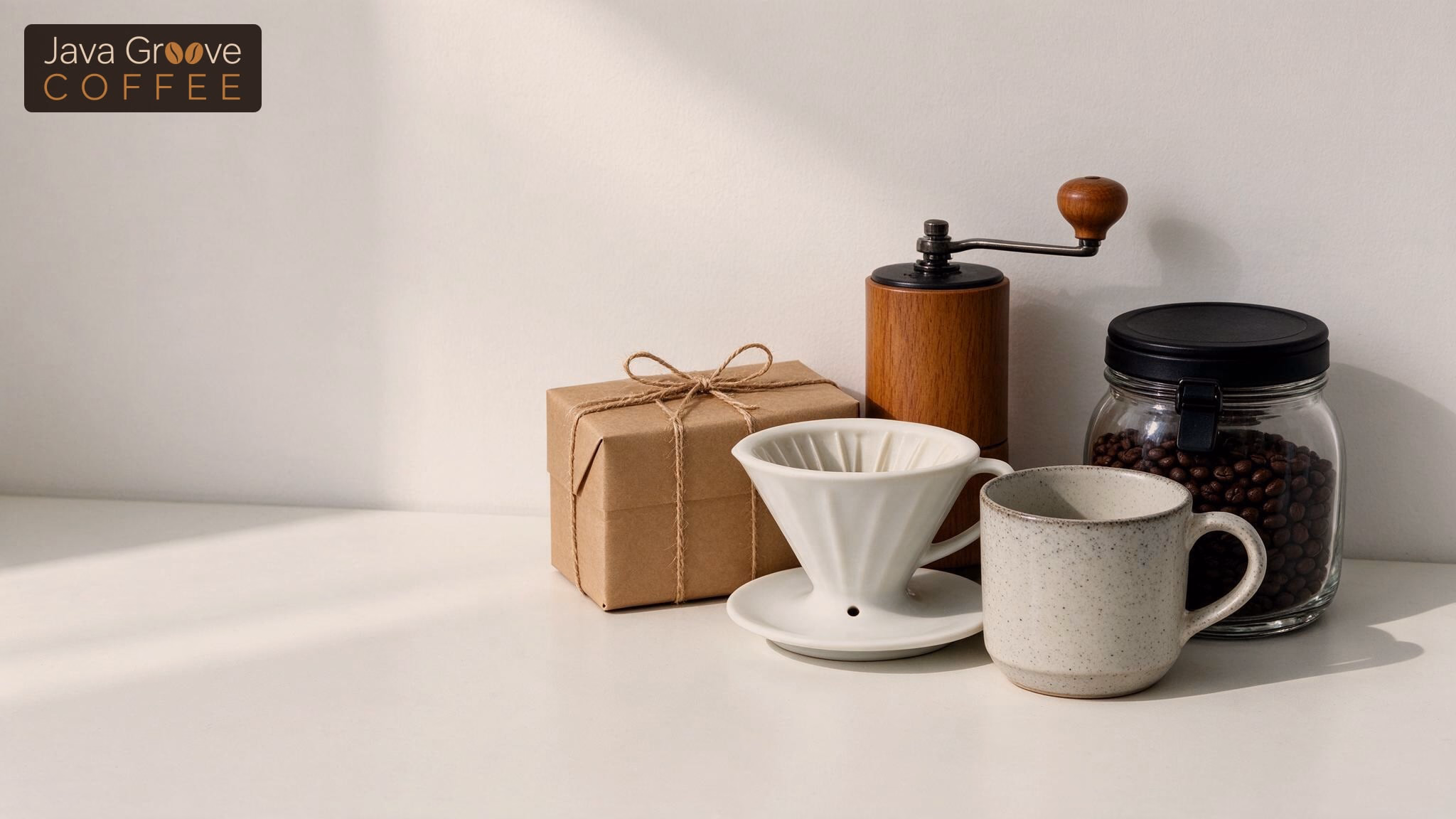 Gifts for coffee lovers, a hand grinder, pour-over dripper, mug and beans