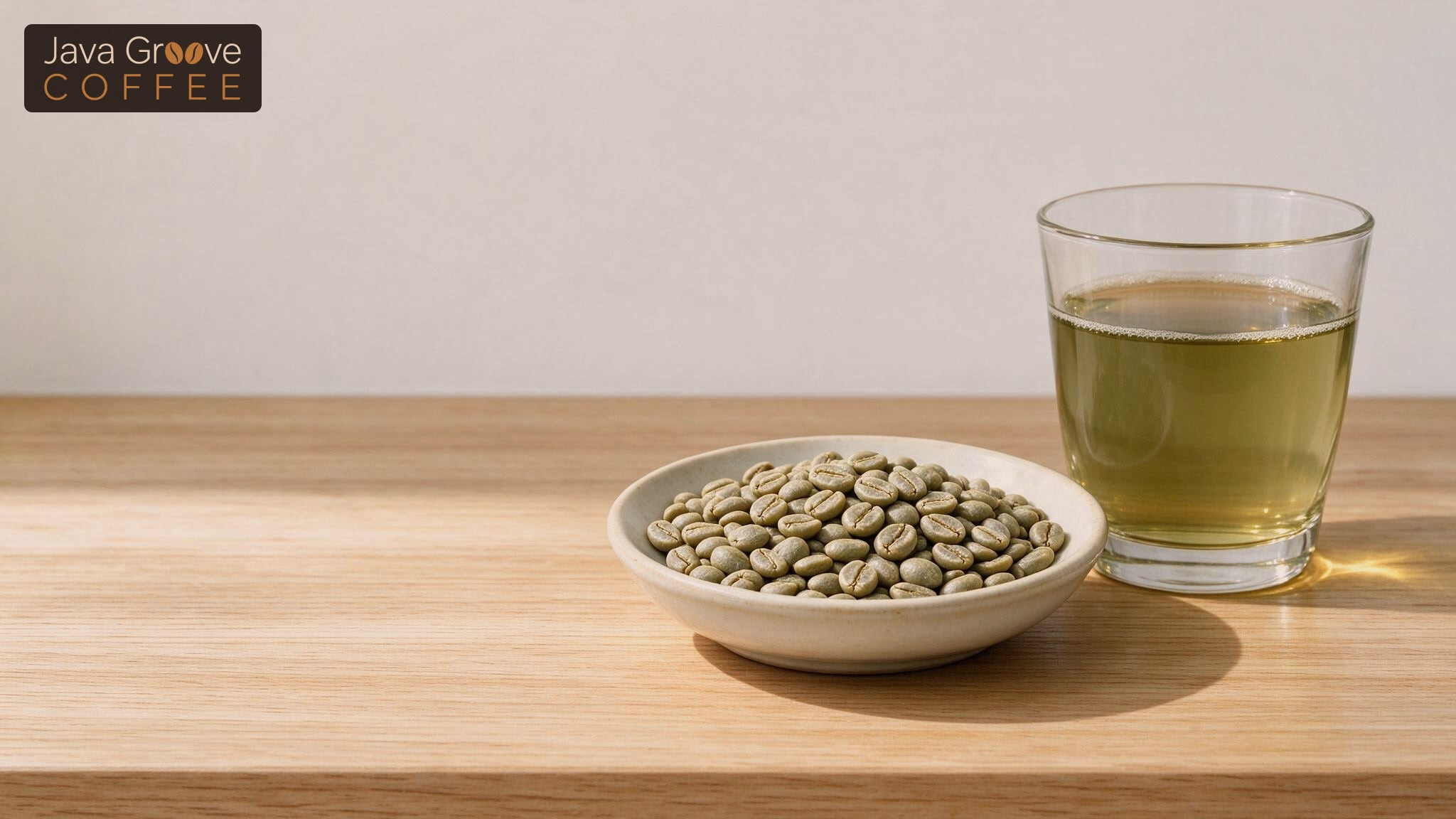 Green coffee: raw unroasted beans beside a glass of brewed green coffee