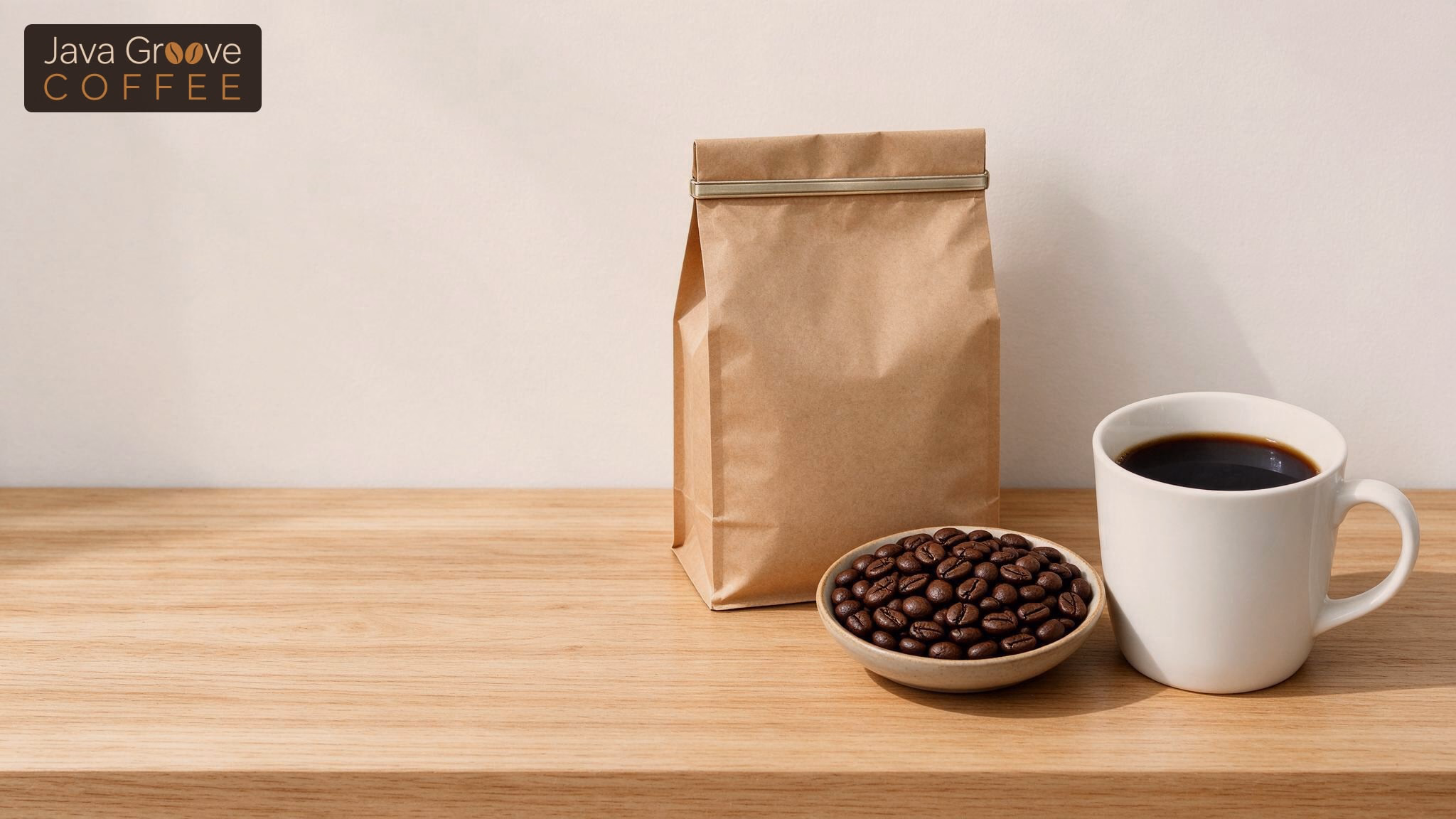 Low acid coffee: kraft bag, dark roast beans and a mug of black coffee