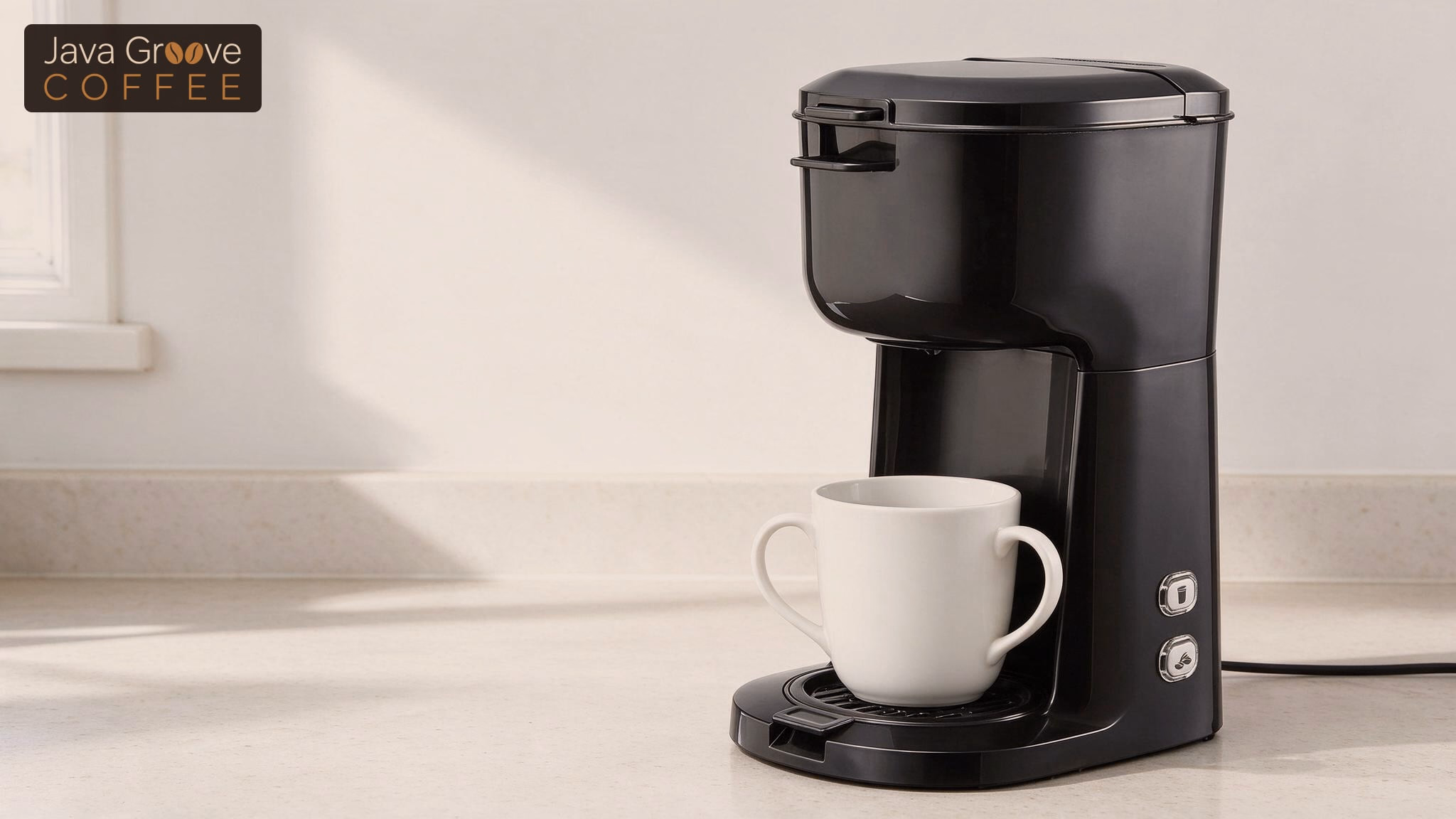 Mainstays single serve coffee maker with a mug on the drip tray