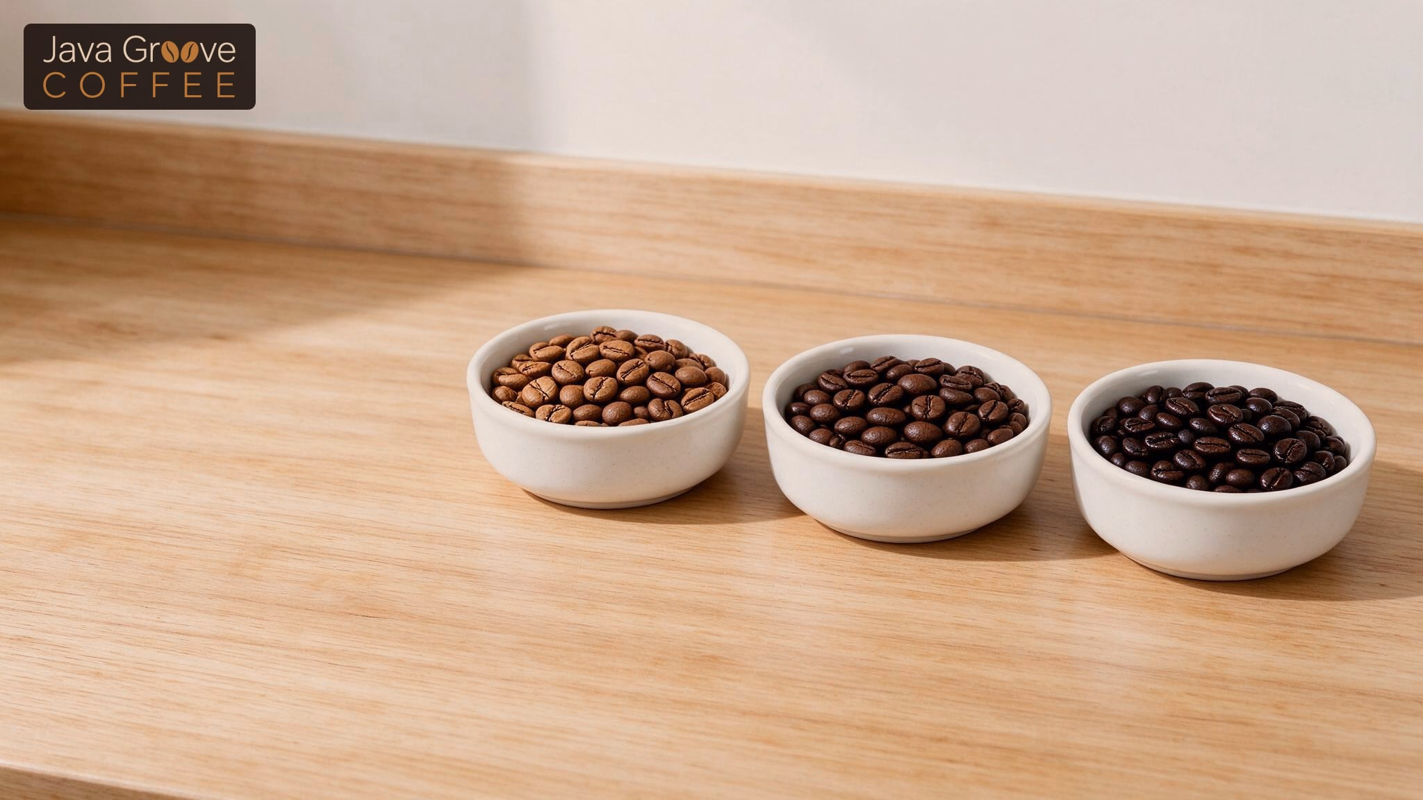 Roasting time and caffeine content: bowls of coffee beans from light to dark roast